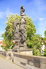 Fototapeta na wymiar One of the statues on the Charles Bridge, Prague, Czech Republic