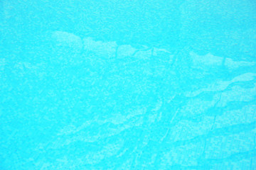 Refreshing blue water in swimming pool, closeup