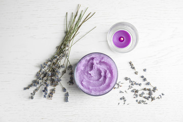 Flat lay composition with lavender flowers and natural cosmetic on wooden background