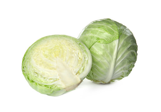 Whole and sliced cabbages on white background. Healthy food