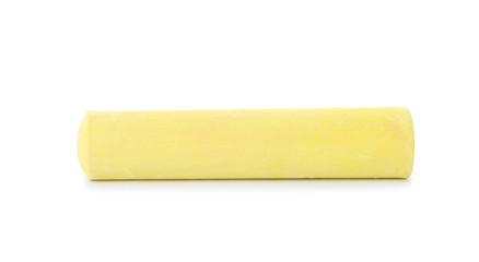 Yellow piece of chalk on white background