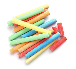 Color pieces of chalk on white background