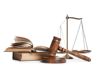 Wooden gavel, scales of justice and books on white background. Law concept