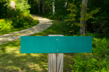 Blank Street Sign with Soft-Focus Road or Path in the Background