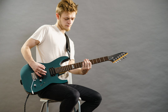 Man playing on electric guitar