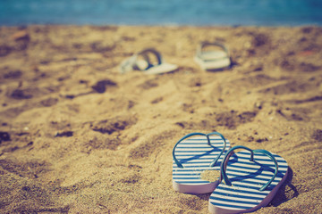 Flip flops on sand beach