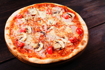 Classical italian pizza with ham and mushrooms, appetizing popular snack, traditional recipe, tasty mediterranean cuisine food concept