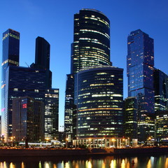 Fototapeta na wymiar Central business center Moscow City - view of the skyscrapers of the Moscow river on the background of the evening downtown, modern architecture of Russia, night summer urban cityscape
