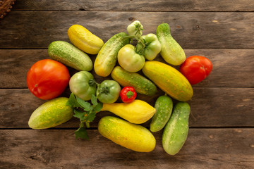 Garden fresh squash cucumber tomato onion pepper with background copy space