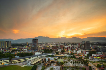 Obraz premium Scenery of Sunset at Ipoh,Perak,Malaysia with aerial view. Soft focus,Blur due to Long Exposure. Visible Noise due to High ISO.