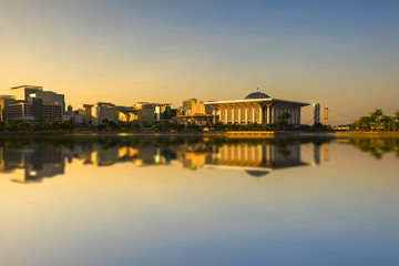 Fototapeta premium Scenery of Sunrise at 'Sultan Mizan Mosque,Putrajaya' with clear blue sky.Soft Focus,Blur due to Long Exposure. Visible Noise due to High ISO.