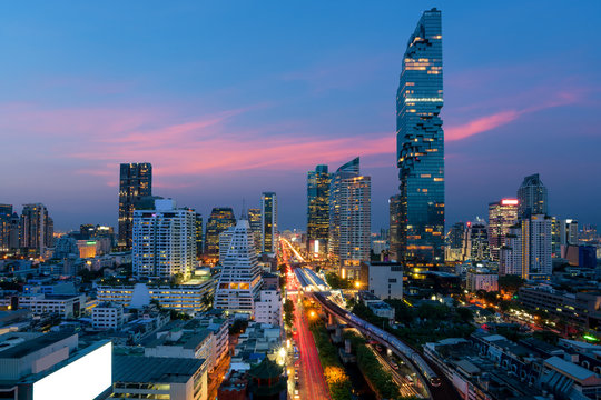 Bangkok Transportation at Dusk with Modern Business Building from top view in Bangkok, Thailand.
