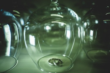 Wedding rings in a glass