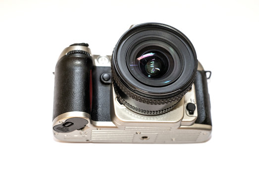 Classic slr camera with big lens. Classic film camera. DSLR camera view from below. 
