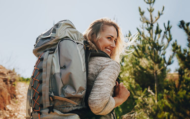 Smiling woman going on a camping © Jacob Lund