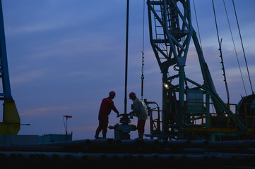 The oil workers in the job