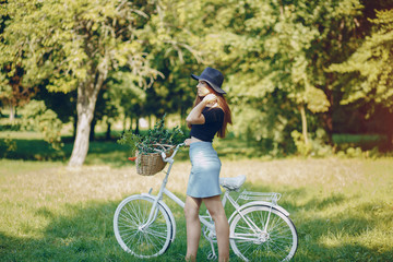 Fototapeta na wymiar Girl with a bike