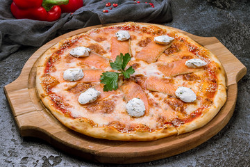 Pizza with salmon and Philadelphia cheese