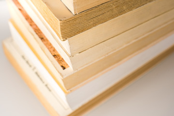Many stacked books with white background with space