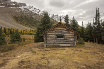 Halfway Hut, vintage landmark log cabin on great hiking trail to Skoki area of Banff National Park near Lake Louise Rocky Mountains Alberta Canada