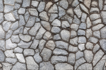 Textured, Moldy and Aged  Natural Gray Stone Wall in Lafayette Cemetery #1, New Orleans, Louisiana, USA