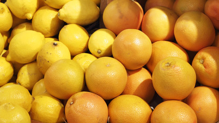 oranges and lemon in basket for sale at the supermarket