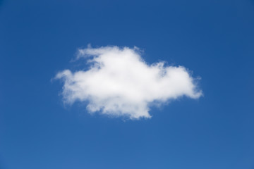One beautiful cloud in the sky. The blue background is beautiful.