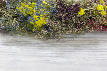 background. defocusing. fragment of a wreath of colored wildflowers