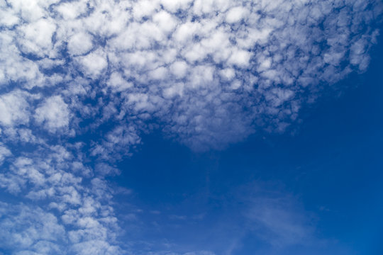 White clouds on the left and blue space on the right to enter the text.