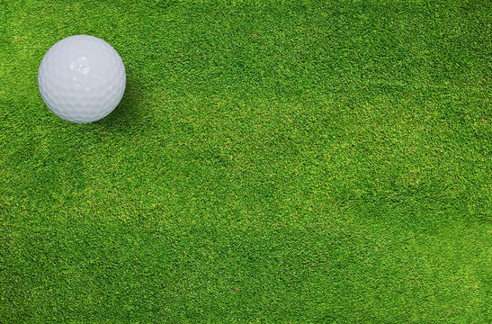 Golf ball on green grass of golf course. Golf sport background.