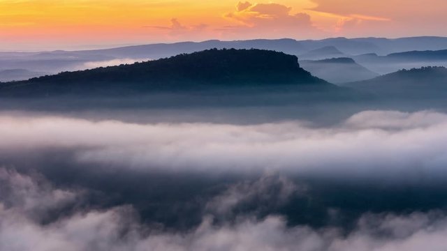 Fog rolling in over the hills at the Pha Mo e Dang in Srisaket Thailand. Time lapse 4K