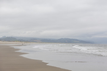 Fototapeta na wymiar Ocean coast. Blur background coastal line. Overcast sky.