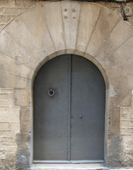old wooden entrance door with antique door handle, Barcelona, Spain