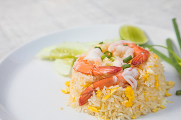 Fried rice with shrimp on the wooden table from top view
