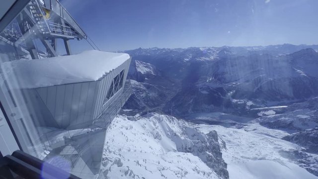 Mountain ropeway station with wide view of the landscape winter snow