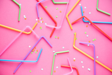 Drinking straws on pink