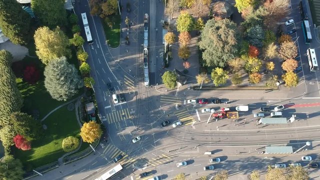 Aerial drone shot following Tram on Bahnhofstrasse from lake Zurich to Paradeplatz in Zurich, Switzerland on an autumn day
