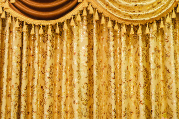 Window decoration gold luxury curtain with tassel background.