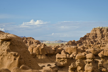The landscape view of the goblin valley state park in the summer sun. 