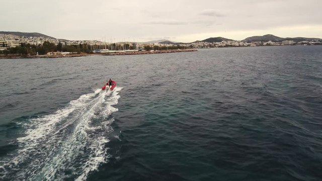 Lightning sailing academy training outside of the Nautical Athletic Club of Voula on a cloudy winter day.
