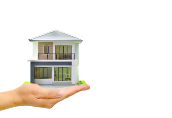 Man hand holding a model home on White background