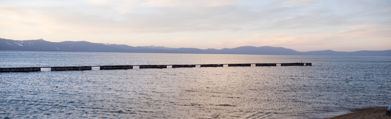 Lake tahoe swimming area - mountains - during sunset