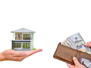Hand holding wallet with US Dollar banknote and miniature house on white background