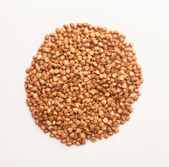 Raw buckwheat on white background