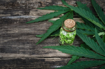 Cannabis oil in small bottle. Herbal medicine. Naturopathy.