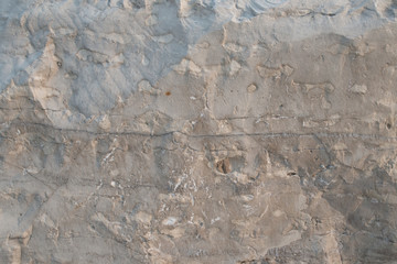 Closeup limestone rock face showing weathered strata Geology walpaper or background