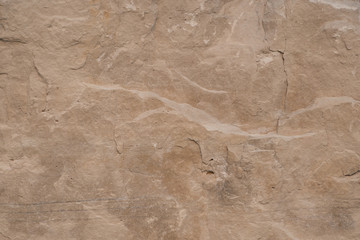 Closeup limestone rock face showing weathered strata Geology walpaper or background