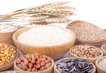 Cereal grains , seeds, beans on wooden background
