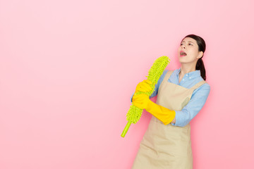 woman imitate the feather stick as the microphone