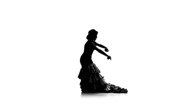 Girl is dancing in a beautiful dress with castanets . White background. Silhouette